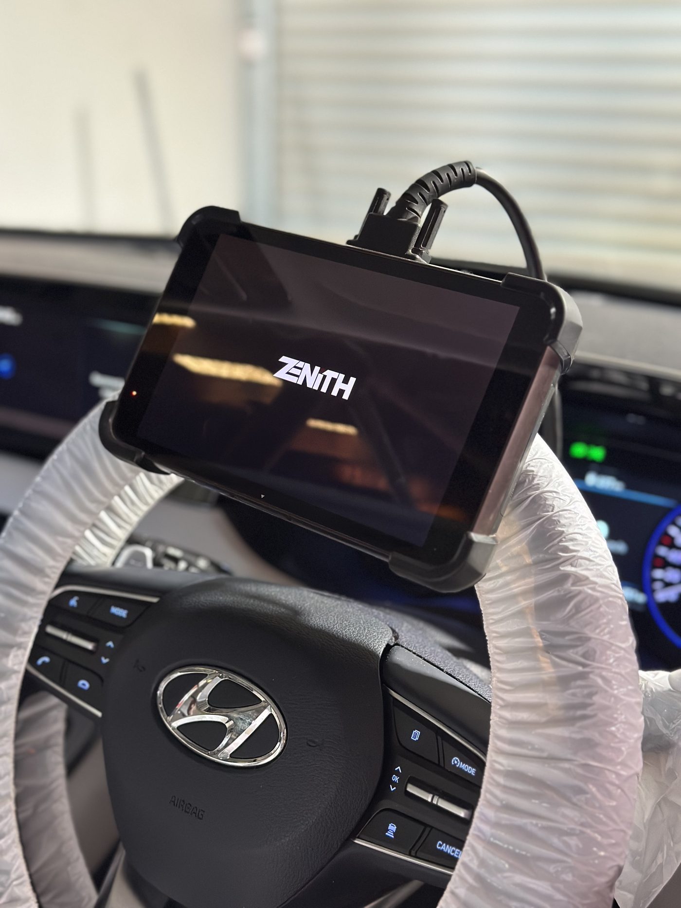 Dealer-level diagnostic scanner in use
