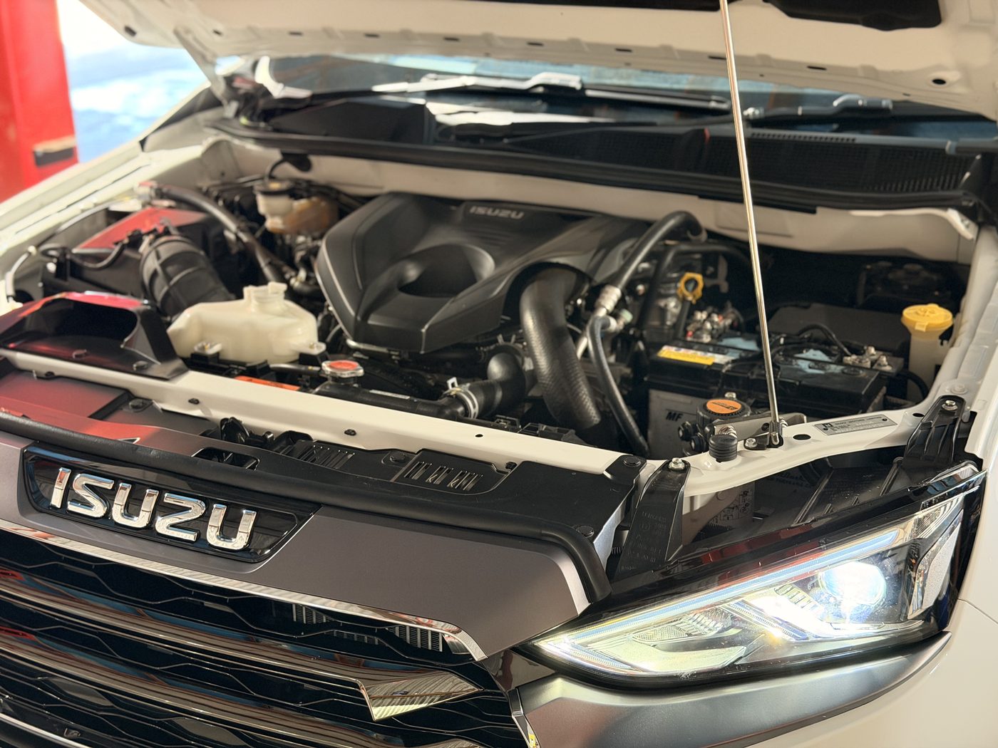 General servicing on a modern SUV engine bay