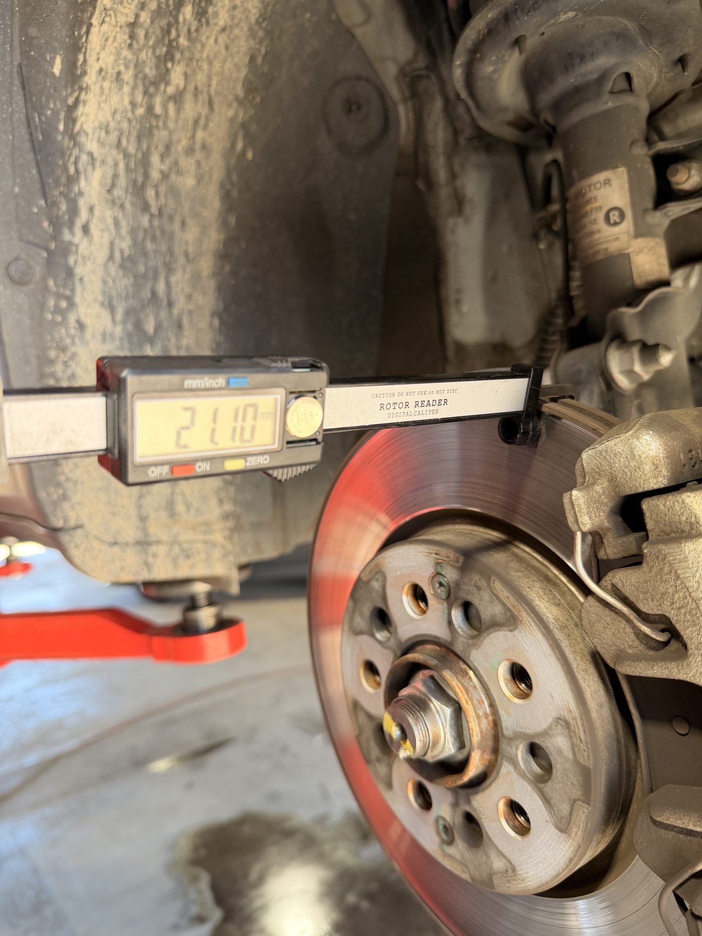 Measuring brake rotor thickness with a digital caliper